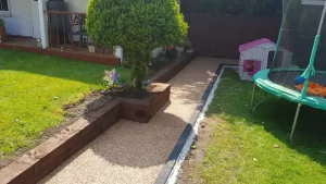 Yellow resin-bound path with a black stone edge
